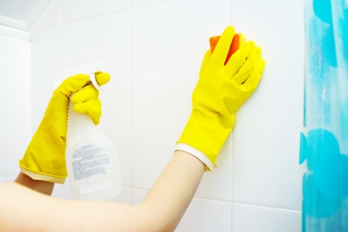 Cleaning a Putney living room before final inspection