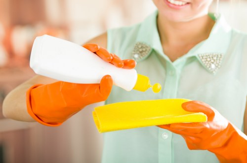 Cleaner preparing a kitchen during a move in clean in Putney