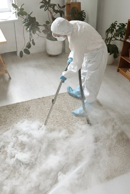 Close-up image of a deep blue carpet with a textured, cut pile surface, showing a uniform, clean appearance. The carpet is situated in a well-lit room, possibly a living space or hallway, with no visible stains or dirt, indicating thorough surface cleaning or maintenance. The description emphasizes the material's appearance and cleanliness, relevant to deep cleaning and sanitisation services provided by Carpet Cleaning Putney in the SW15 Putney area under their mould and damp carpet solutions. The overall setting suggests a fresh, hygienic environment suitable for domestic cleaning applications.